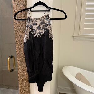 FP Movement by Free People Black and Cream Floral Bodysuit
